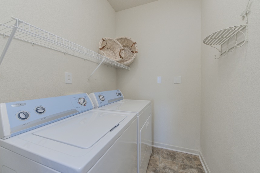 Laundry room with storage space in Bloomington.